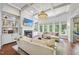 Bright living room with fireplace, built-in shelves, and large windows for natural light at 112 Roseberry Way, Holly Springs, NC 27540