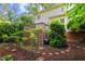 A charming backyard with mature trees and landscaping provides a serene outdoor living space at 113 Wilander Dr, Cary, NC 27511