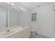 Bathroom with double sinks, a large mirror, and a shower/tub combination at 113 Wilander Dr, Cary, NC 27511