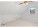 Finished bonus room with dormer ceilings, carpeted floor, built in bench with storage, and ceiling fan at 113 Wilander Dr, Cary, NC 27511