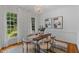 Elegant dining room with a chandelier, light walls, and ample natural light from two windows at 113 Wilander Dr, Cary, NC 27511