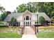 Aesthetic clubhouse exterior featuring a charming bridge, well-manicured landscaping, and a serene surrounding at 113 Wilander Dr, Cary, NC 27511