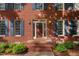 Inviting front entrance of a red brick home with a decorative wreath on the front door at 113 Wilander Dr, Cary, NC 27511