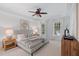 Serene main bedroom with neutral tones, ceiling fan, and windows providing natural light at 113 Wilander Dr, Cary, NC 27511