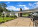 Carport with a concrete driveway which offers ample parking and protection from the elements at 1169 Clayhole Rd, Dunn, NC 28334