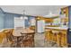 Open dining room and kitchen area with a spacious table, seating for eight, and ample counter space at 1169 Clayhole Rd, Dunn, NC 28334