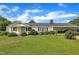 Charming single-story home featuring a well-maintained lawn and convenient carport for covered parking at 1169 Clayhole Rd, Dunn, NC 28334
