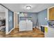 Well-equipped laundry room with modern appliances and ample storage space for cleaning supplies at 1169 Clayhole Rd, Dunn, NC 28334