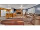 Spacious living room featuring a brick fireplace, wood-look flooring, and comfortable seating at 1169 Clayhole Rd, Dunn, NC 28334