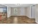 Well-lit living room showcasing sleek wood flooring and a comfortable, inviting atmosphere at 1169 Clayhole Rd, Dunn, NC 28334