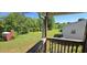 Scenic backyard view from the balcony, showing a spacious yard with mature trees at 1223 Wallace St, Burlington, NC 27215