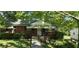 Charming brick home with a well-maintained front yard and inviting covered porch at 1223 Wallace St, Burlington, NC 27215