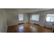 Bright living room featuring hardwood floors, large windows, and neutral walls at 1223 Wallace St, Burlington, NC 27215
