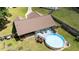 Aerial view of this home featuring a backyard pool, wooden deck, and fenced yard, creating an ideal outdoor living space at 123 Terawood Farm Dr, Willow Springs, NC 27592