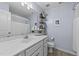 Well-lit bathroom with a single sink vanity, decorative shelves, and modern fixtures at 123 Terawood Farm Dr, Willow Springs, NC 27592