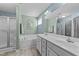 The spacious bathroom has dual sinks, a soaking tub, and a tiled walk-in shower at 123 Terawood Farm Dr, Willow Springs, NC 27592