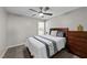 Neutral bedroom with a full-size bed, ceiling fan, and a view of the window at 123 Terawood Farm Dr, Willow Springs, NC 27592