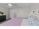 Serene bedroom featuring a queen-size bed, ceiling fan, and closet access at 123 Terawood Farm Dr, Willow Springs, NC 27592