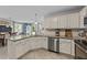 Modern kitchen featuring granite countertops, stainless steel appliances, and seamless flow to the dining area at 123 Terawood Farm Dr, Willow Springs, NC 27592