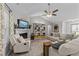 Comfortable living room with fireplace, bookshelves, and vaulted ceiling with ceiling fan at 123 Terawood Farm Dr, Willow Springs, NC 27592
