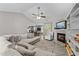 Spacious living room with vaulted ceiling, fireplace, and a view of the eat-in kitchen at 123 Terawood Farm Dr, Willow Springs, NC 27592