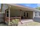 This home features a back patio with string lights and a grill at 123 Terawood Farm Dr, Willow Springs, NC 27592