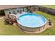 Enjoy this backyard's above-ground pool, wooden deck, and fenced yard, perfect for outdoor relaxation and summer fun at 123 Terawood Farm Dr, Willow Springs, NC 27592