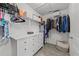 This walk-in closet features white walls, gray floors, and lots of storage space at 123 Terawood Farm Dr, Willow Springs, NC 27592