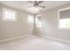 Bright bedroom with neutral walls, carpet and multiple light-filled windows at 1313 Dale St, Raleigh, NC 27605