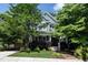 Charming two-story home with blue siding and a well-manicured front yard, shaded by mature trees at 1313 Dale St, Raleigh, NC 27605