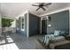 Relaxing front porch with a swing, cushioned seating, and a ceiling fan, perfect for outdoor enjoyment at 1313 Dale St, Raleigh, NC 27605