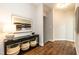 Inviting hallway featuring hardwood floors, decorative console table, and stylish decor, creating a welcoming entrance at 1313 Dale St, Raleigh, NC 27605