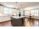 Well-lit kitchen with granite countertops, modern appliances, and open layout leading to a cozy dining area and seating at 1313 Dale St, Raleigh, NC 27605