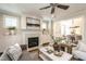 Elegant living room featuring a marble fireplace, built-in cabinetry, and an open layout to the dining area at 1313 Dale St, Raleigh, NC 27605