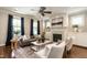 Cozy living room with a fireplace, mantel, and stylish seating arrangement, bathed in natural light at 1313 Dale St, Raleigh, NC 27605