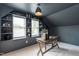 Office with built-in shelving, natural light, wooden desk and carpet flooring at 1313 Dale St, Raleigh, NC 27605