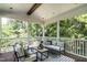 Relaxing screened porch featuring stylish outdoor furniture and scenic backyard views at 1313 Dale St, Raleigh, NC 27605