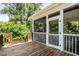 Charming screened porch offering a cozy outdoor space with views of the lush surroundings at 1313 Dale St, Raleigh, NC 27605