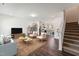 Bright living area features hardwood floors, an open layout, and plenty of seating at 140 Camel Crazies Pl # 39, Lillington, NC 27546