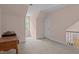 Spacious carpeted bedroom featuring a charming arched window and painted pink walls at 191 Nc 56, Louisburg, NC 27549