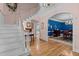 Elegant foyer with a staircase and an arched entry to the dining room at 191 Nc 56, Louisburg, NC 27549
