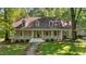 Charming home with a welcoming front porch and beautiful landscaping at 191 Nc 56, Louisburg, NC 27549