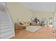 Spacious open-plan living room with hardwood floors, dining area, and comfortable seating at 191 Nc 56, Louisburg, NC 27549
