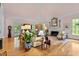 Bright living room featuring a fireplace, hardwood floors, and elegant decor at 191 Nc 56, Louisburg, NC 27549