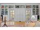 Bright living room with built-in shelving, cabinets and french doors at 191 Nc 56, Louisburg, NC 27549