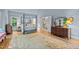 Main bedroom featuring a four-poster bed, hardwood floors, and ensuite bathroom access at 191 Nc 56, Louisburg, NC 27549