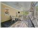 Spacious screened-in porch with ceiling fans and comfortable furniture at 191 Nc 56, Louisburg, NC 27549