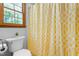 Bathroom with a toilet and a patterned shower curtain at 2100 Fort Dr, Clayton, NC 27520