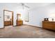 Bedroom with neutral walls, carpet, dressers, and ensuite bathroom at 2100 Fort Dr, Clayton, NC 27520