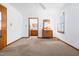 Bedroom with neutral walls, carpet and ensuite bathroom at 2100 Fort Dr, Clayton, NC 27520